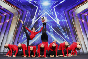 The Acro Crew performs onstage with a dog in America's Got Talent Season 21 Episode 1.